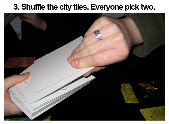 3. Shuffle the city tiles. Everyone pick two.